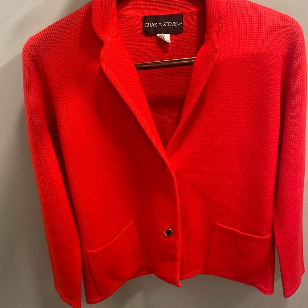 Classy sweater. Perfect for any occasion. Color is a bright red.